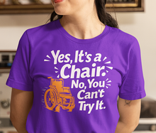 Load image into Gallery viewer, Wheelchair Humor T‑Shirt — "Yes, It’s a Chair. No, You Can’t Try It."

